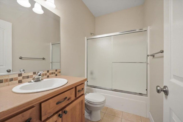 3405 W Kens Ct, Spokane, WA 99208 - bathroom with vanity, tile patterned floors, enclosed tub / shower combo, and decorative backsplash