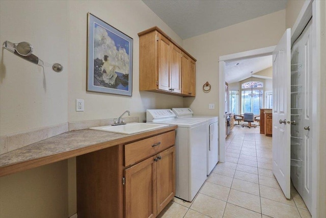 3405 W Kens Ct, Spokane, WA 99208 - laundry area with cabinet space, independent washer and dryer, and light tile patterned floors