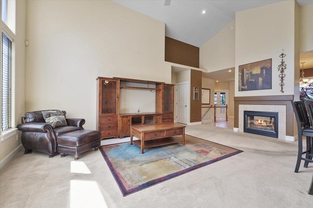 3405 W Kens Ct, Spokane, WA 99208 - carpeted living room featuring high vaulted ceiling and a fireplace