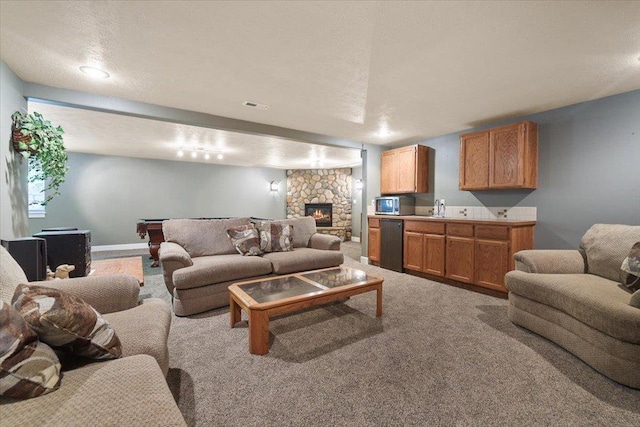 3405 W Kens Ct, Spokane, WA 99208 - carpeted living area with a stone fireplace and billiards