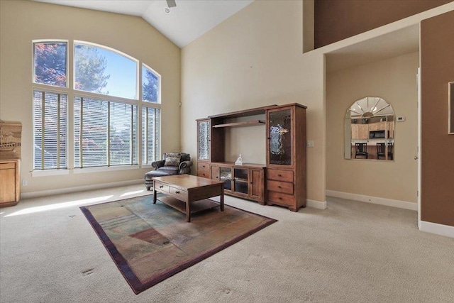 3405 W Kens Ct, Spokane, WA 99208 - living room featuring carpet flooring, healthy amount of natural light, and high vaulted ceiling