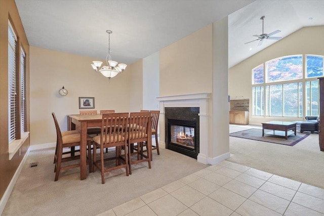 3405 W Kens Ct, Spokane, WA 99208 - dining area with light colored carpet, light tile patterned floors, a chandelier, ceiling fan, and high vaulted ceiling