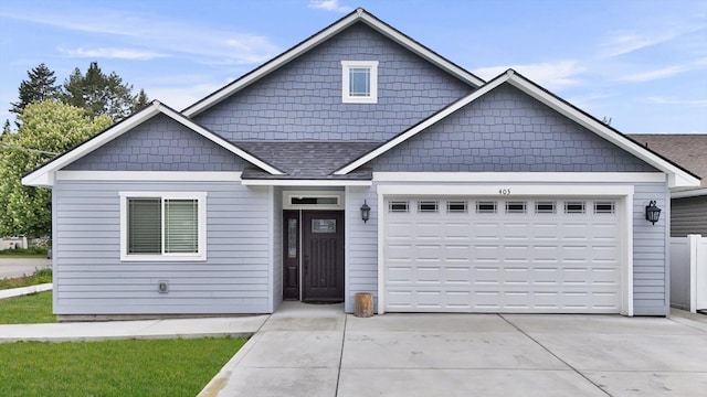 403 N Calvin Ln, Spokane Valley, WA 99216 - view of front of house with concrete driveway, an attached garage, and a shingled roof