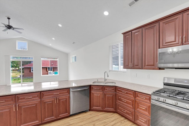 403 N Calvin Ln, Spokane Valley, WA 99216 - kitchen with stainless steel appliances, ceiling fan, light wood-type flooring, light stone counters, and lofted ceiling