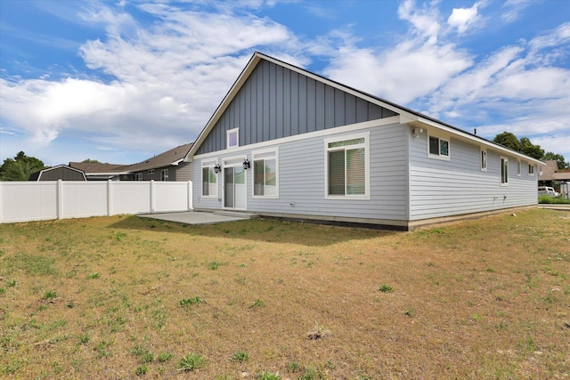 403 N Calvin Ln, Spokane Valley, WA 99216 - rear view of property with board and batten siding and a patio