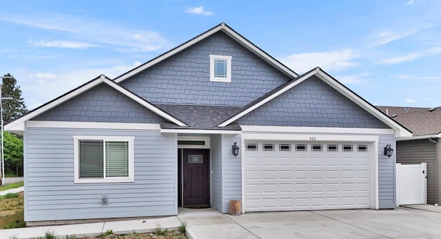403 N Calvin Ln, Spokane Valley, WA 99216 - craftsman-style home with a garage, concrete driveway, and a shingled roof