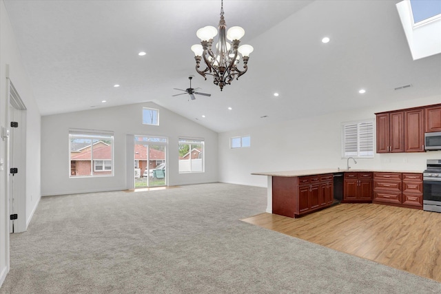 403 N Calvin Ln, Spokane Valley, WA 99216 - kitchen featuring stainless steel appliances, open floor plan, light carpet, recessed lighting, and high vaulted ceiling