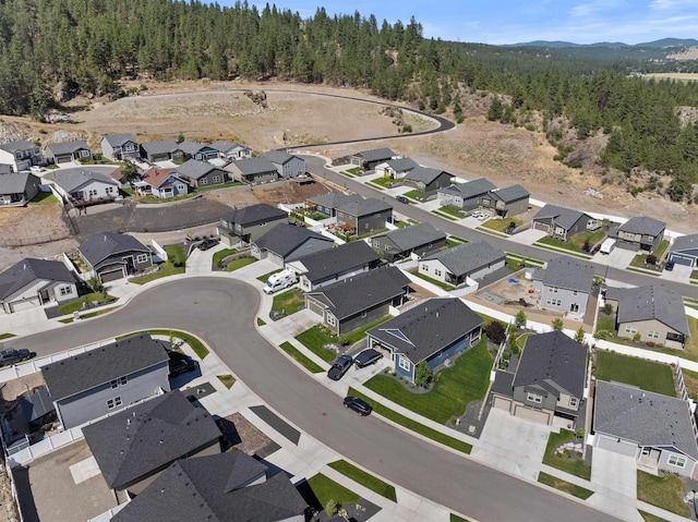 3228 N Mckinnon Rd, Spokane, WA 99217 - aerial view of property and surrounding area with a heavily wooded area and nearby suburban area