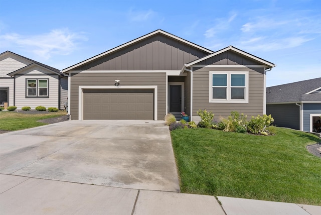 3228 N Mckinnon Rd, Spokane, WA 99217 - ranch-style house with board and batten siding, a garage, a front yard, and concrete driveway