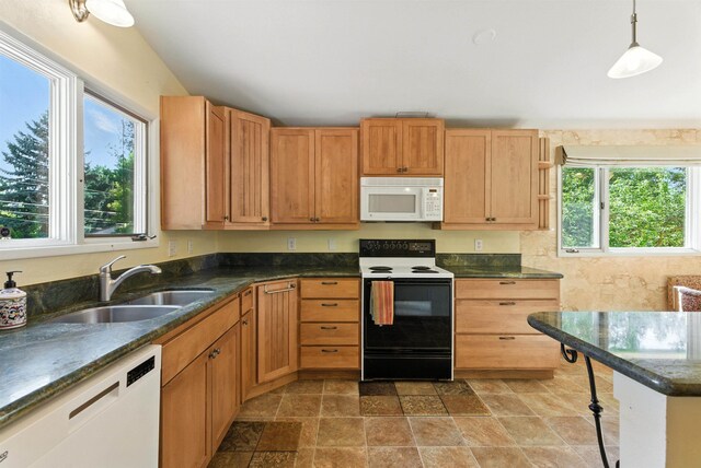 3832 S Cook St, Spokane, WA 99223 - kitchen with white appliances, stone finish floors, dark stone counters, and hanging light fixtures
