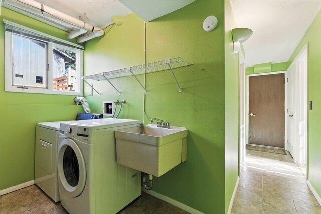 3832 S Cook St, Spokane, WA 99223 - washroom featuring washing machine and dryer and baseboards