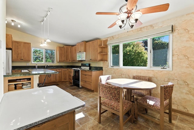 3832 S Cook St, Spokane, WA 99223 - kitchen with white appliances, vaulted ceiling, dark countertops, open shelves, and ceiling fan