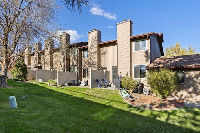 3714 S Alder Cir, Spokane, WA 99223 - back of house with a chimney, a patio area, and a tile roof