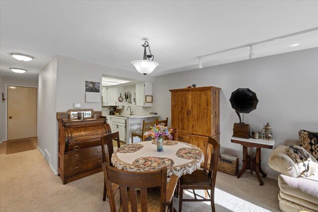 3714 S Alder Cir, Spokane, WA 99223 - dining area featuring light carpet and track lighting