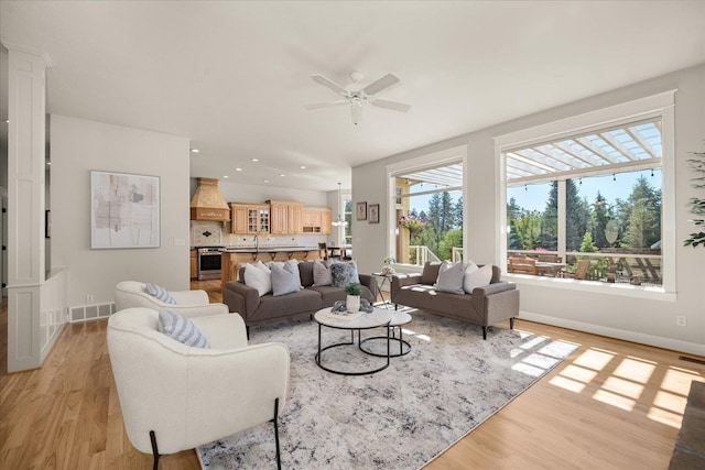 5614 N Thierman Rd, Spokane, WA 99217 - living area featuring light wood-style flooring, a ceiling fan, and recessed lighting
