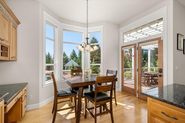 5614 N Thierman Rd, Spokane, WA 99217 - dining space featuring light wood-type flooring and a chandelier