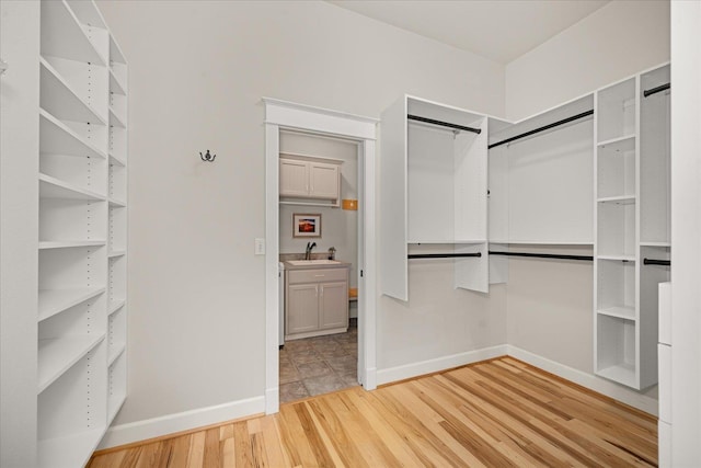 5614 N Thierman Rd, Spokane, WA 99217 - walk in closet featuring light wood-type flooring and a sink