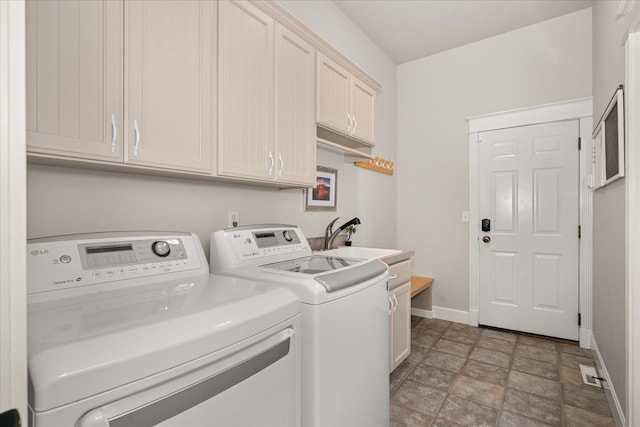 5614 N Thierman Rd, Spokane, WA 99217 - laundry room with independent washer and dryer, cabinet space, and stone finish flooring