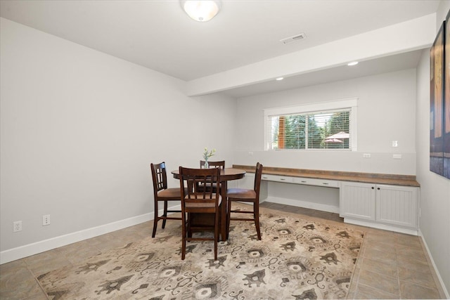 5614 N Thierman Rd, Spokane, WA 99217 - dining room with built in study area and light tile patterned floors