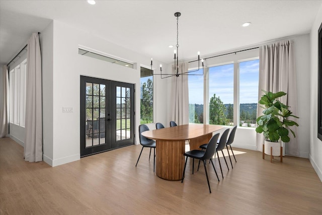 5257 S Falcon Point Ct, Spokane, WA 99224 - dining area with french doors, a chandelier, healthy amount of natural light, light wood-style floors, and recessed lighting