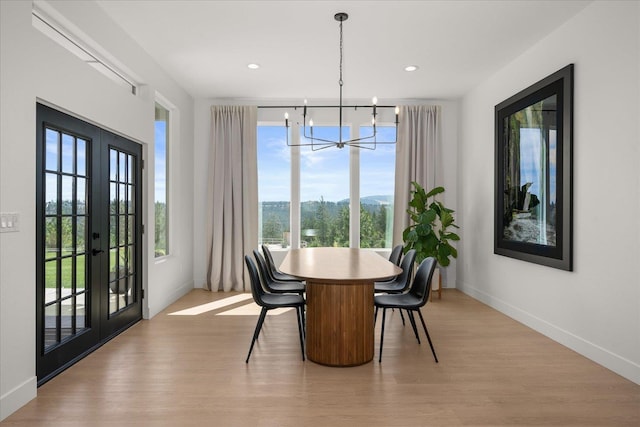 5257 S Falcon Point Ct, Spokane, WA 99224 - dining space featuring a chandelier, light wood finished floors, french doors, and recessed lighting