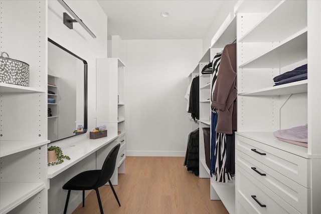 5257 S Falcon Point Ct, Spokane, WA 99224 - spacious closet featuring light wood-style flooring and built in desk