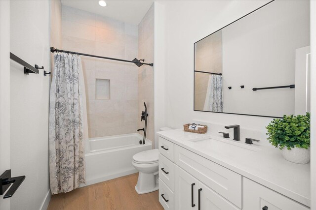 5257 S Falcon Point Ct, Spokane, WA 99224 - full bathroom featuring vanity, wood finished floors, and shower / bath combo