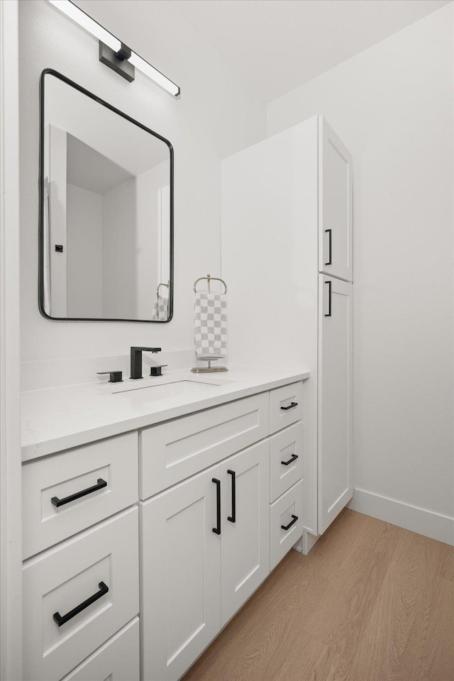 5257 S Falcon Point Ct, Spokane, WA 99224 - bathroom featuring wood finished floors and vanity