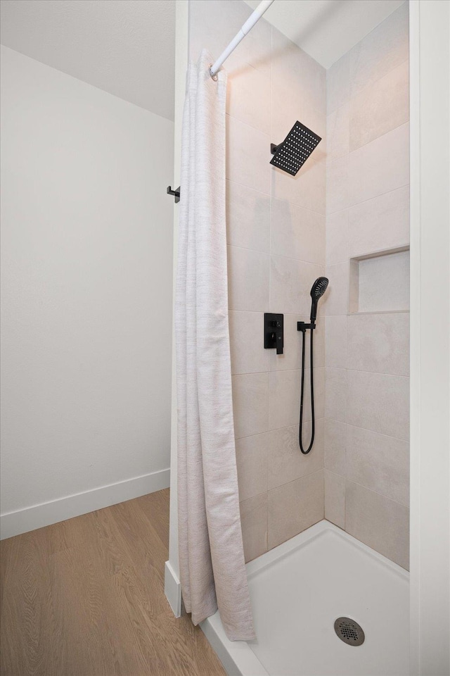 5257 S Falcon Point Ct, Spokane, WA 99224 - full bathroom featuring tiled shower and wood finished floors