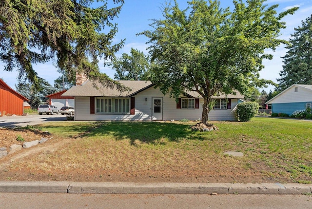 12911 E Desmet Ave, Spokane, WA 99216 - ranch-style home featuring a front yard and a chimney
