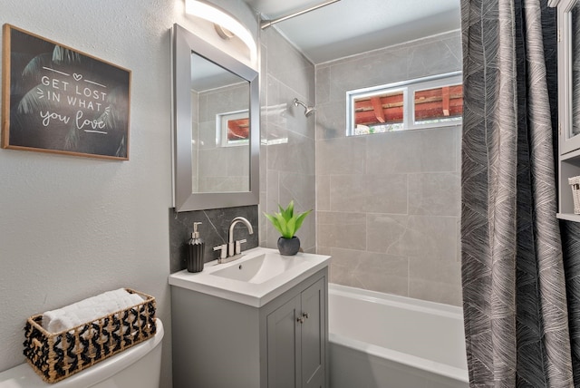 12911 E Desmet Ave, Spokane, WA 99216 - full bathroom featuring shower / bath combination with curtain, vanity, and tasteful backsplash
