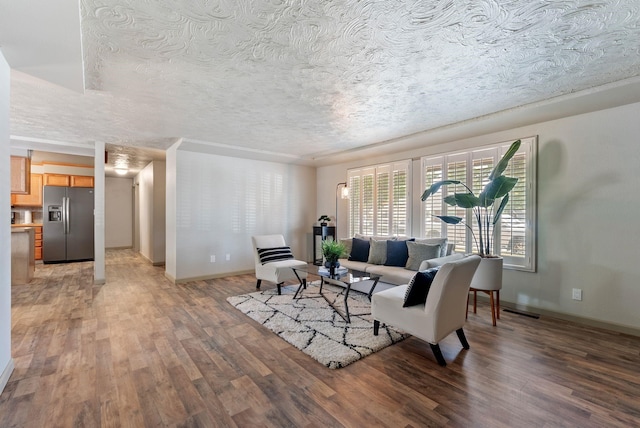 12911 E Desmet Ave, Spokane, WA 99216 - living area featuring light wood-style flooring and a textured ceiling