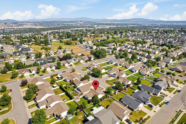 1720 W Briar Ln, Spokane, WA 99208 - aerial overview of property's location featuring a mountainous background and nearby suburban area