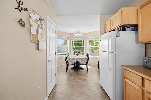 1720 W Briar Ln, Spokane, WA 99208 - kitchen with freestanding refrigerator, light brown cabinets, and a chandelier