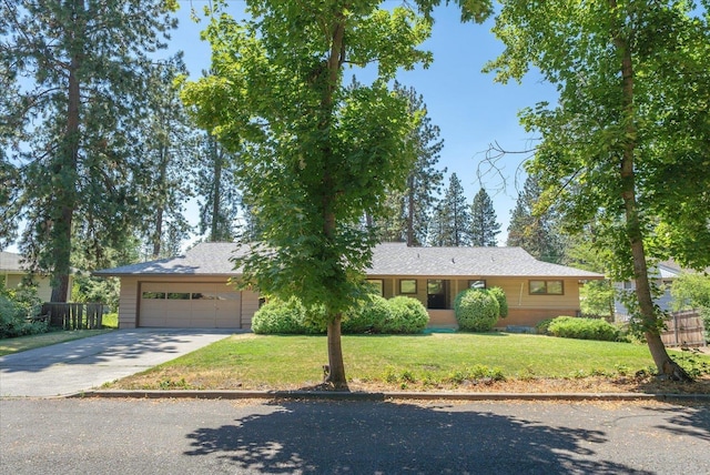 11322 E 18th Ave, Spokane, WA 99206 - ranch-style home with concrete driveway and a garage