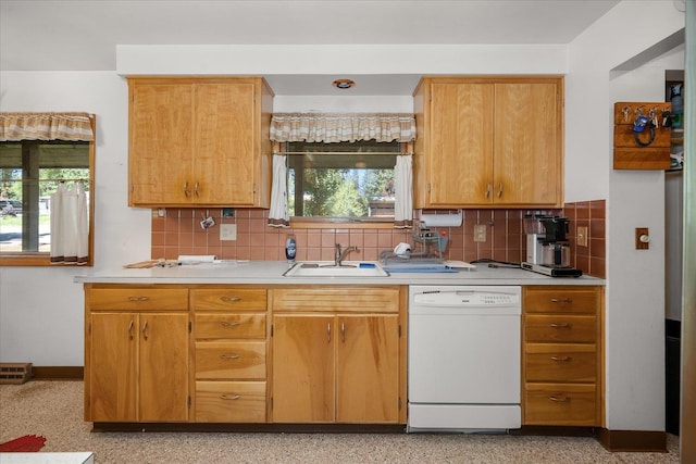 11322 E 18th Ave, Spokane, WA 99206 - kitchen featuring white dishwasher, light countertops, and tasteful backsplash