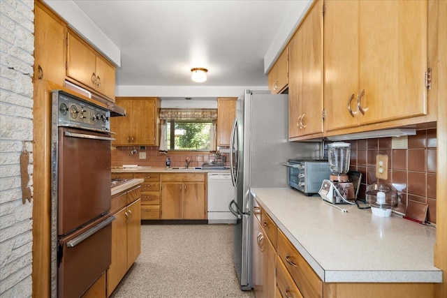 11322 E 18th Ave, Spokane, WA 99206 - kitchen with stainless steel appliances, a warming drawer, decorative backsplash, light countertops, and brown cabinetry