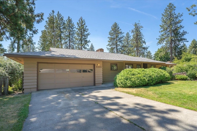 11322 E 18th Ave, Spokane, WA 99206 - single story home featuring concrete driveway, an attached garage, a front lawn, and a chimney
