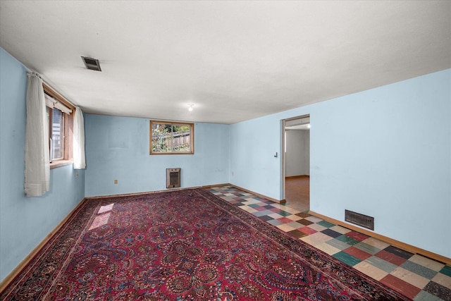 11322 E 18th Ave, Spokane, WA 99206 - empty room with healthy amount of natural light and heating unit