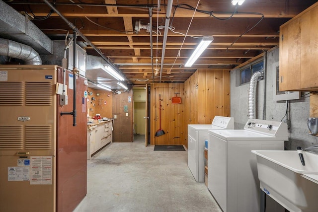 11322 E 18th Ave, Spokane, WA 99206 - unfinished basement featuring separate washer and dryer, heating unit, and a workshop area