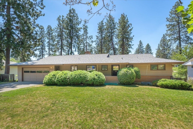 11322 E 18th Ave, Spokane, WA 99206 - ranch-style home featuring an attached garage, a front lawn, driveway, and a chimney