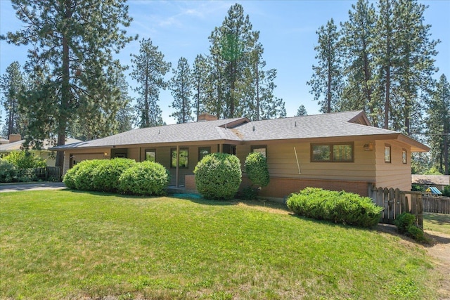 11322 E 18th Ave, Spokane, WA 99206 - ranch-style house featuring brick siding, an attached garage, driveway, and a chimney