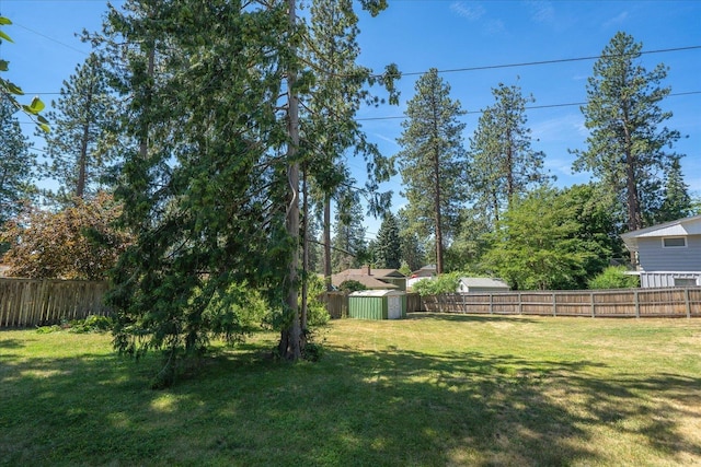 11322 E 18th Ave, Spokane, WA 99206 - fenced backyard featuring a storage unit