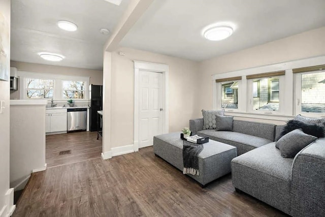 1518 W 6th Ave, Spokane, WA 99204 - living room with dark wood finished floors and healthy amount of natural light