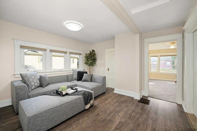 1518 W 6th Ave, Spokane, WA 99204 - living area featuring healthy amount of natural light, dark wood finished floors, and beam ceiling