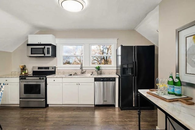 1518 W 6th Ave, Spokane, WA 99204 - kitchen with appliances with stainless steel finishes, lofted ceiling, white cabinets, dark wood-type flooring, and light stone counters