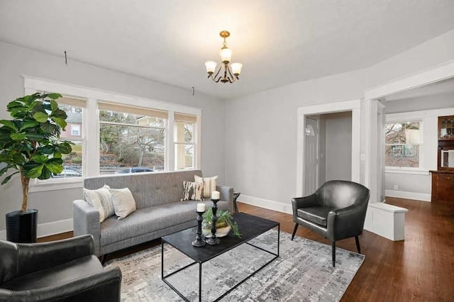 1518 W 6th Ave, Spokane, WA 99204 - living room featuring healthy amount of natural light, a chandelier, and wood finished floors