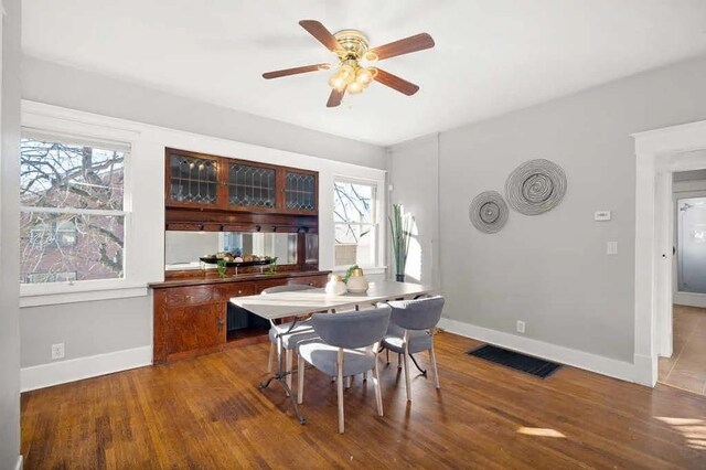 1518 W 6th Ave, Spokane, WA 99204 - dining area featuring healthy amount of natural light, a ceiling fan, and dark wood-type flooring