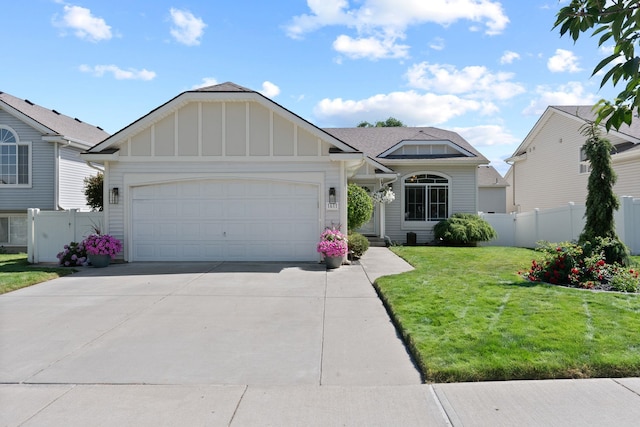 1611 W Tieton Ave, Spokane, WA 99208 - view of front of property featuring board and batten siding, an attached garage, and concrete driveway