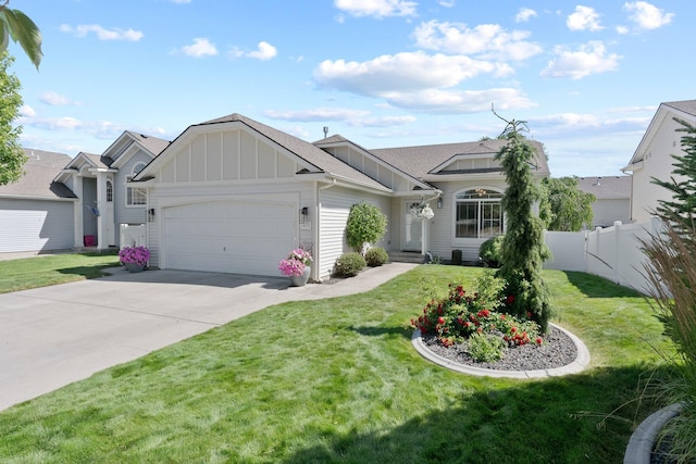1611 W Tieton Ave, Spokane, WA 99208 - view of front of home featuring board and batten siding, an attached garage, and concrete driveway